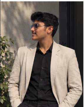 Ayush in a light blazer